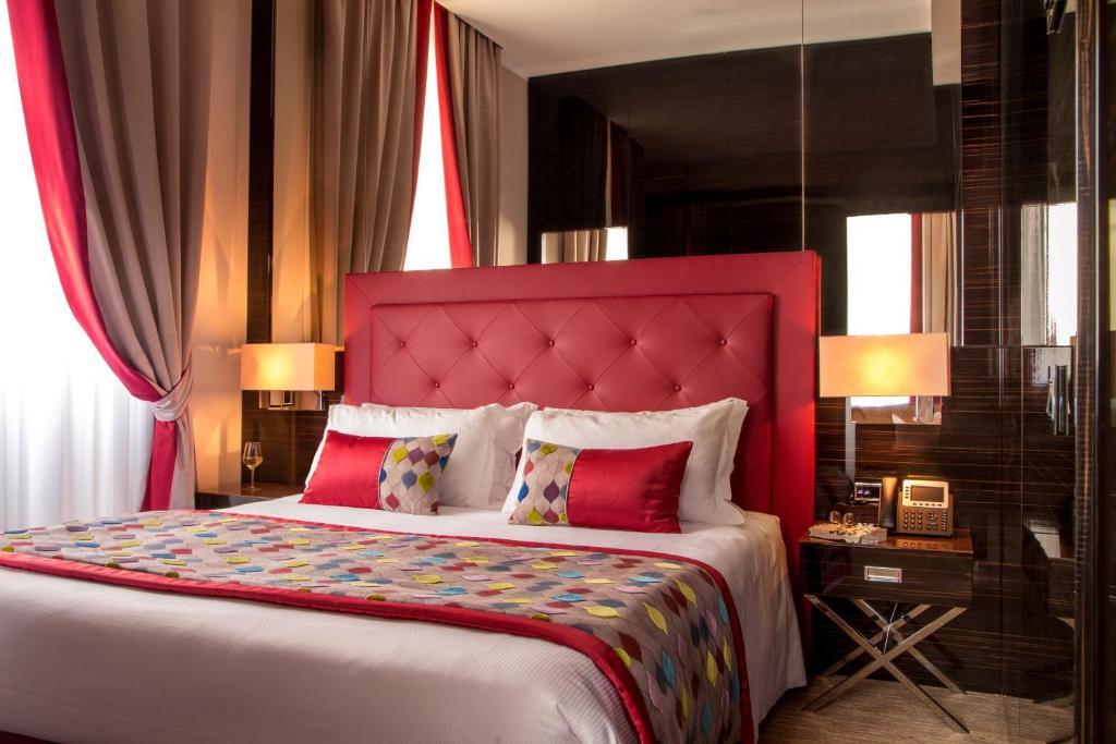 Posteľ alebo postele v izbe v ubytovaní Gioberti Art Hotel