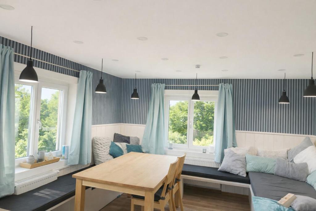 a living room with a couch and a table at Ferienwohnung Gartenglück im Mölltal in Semslach