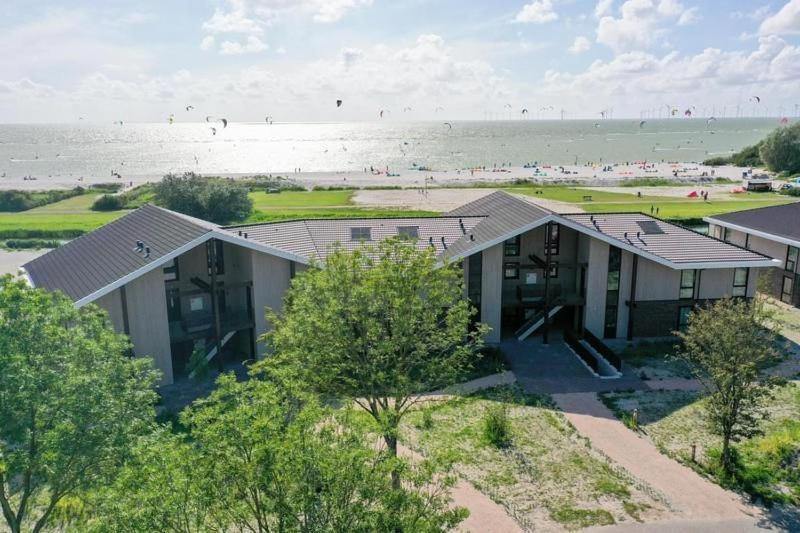 an overhead view of a house next to the beach at MarinaPark Beach Resort Soal - Wellness Apartments in Workum
