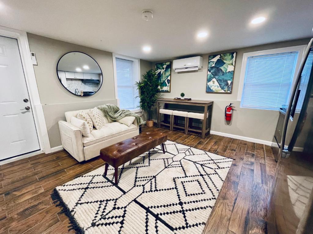 a living room with a couch and a table at Cozy Corner in East Stroudsburg