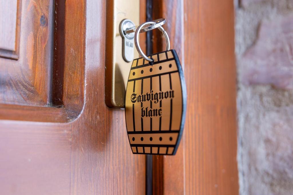 a padlock on a door with the words congratulations to karma at István Pince a penzión in Šahy