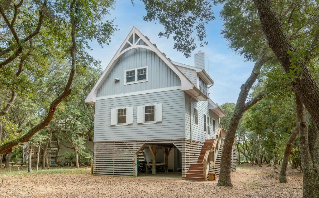 a large white house with a gambrel roof at Pappia - Duck, Sanderling, Oceanside, 150 Yards to Beach, on Lake, Community Pool in Duck