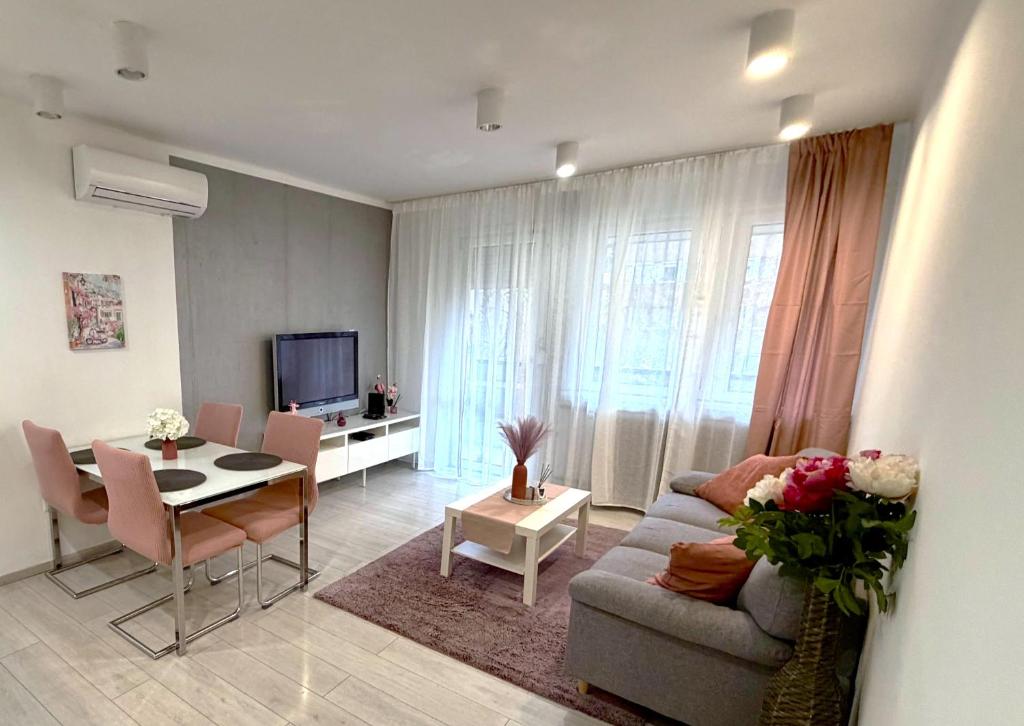 a living room with a couch and a table at Basilica Apartments in Budapest