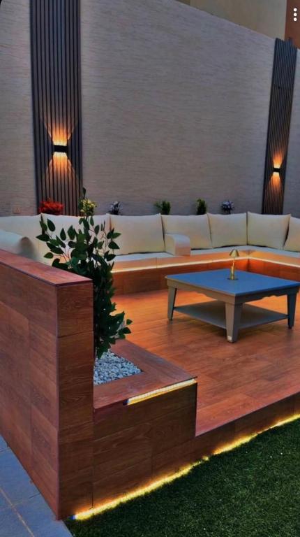 a living room with a couch and a coffee table at شاليهات سمو بارك in Taif