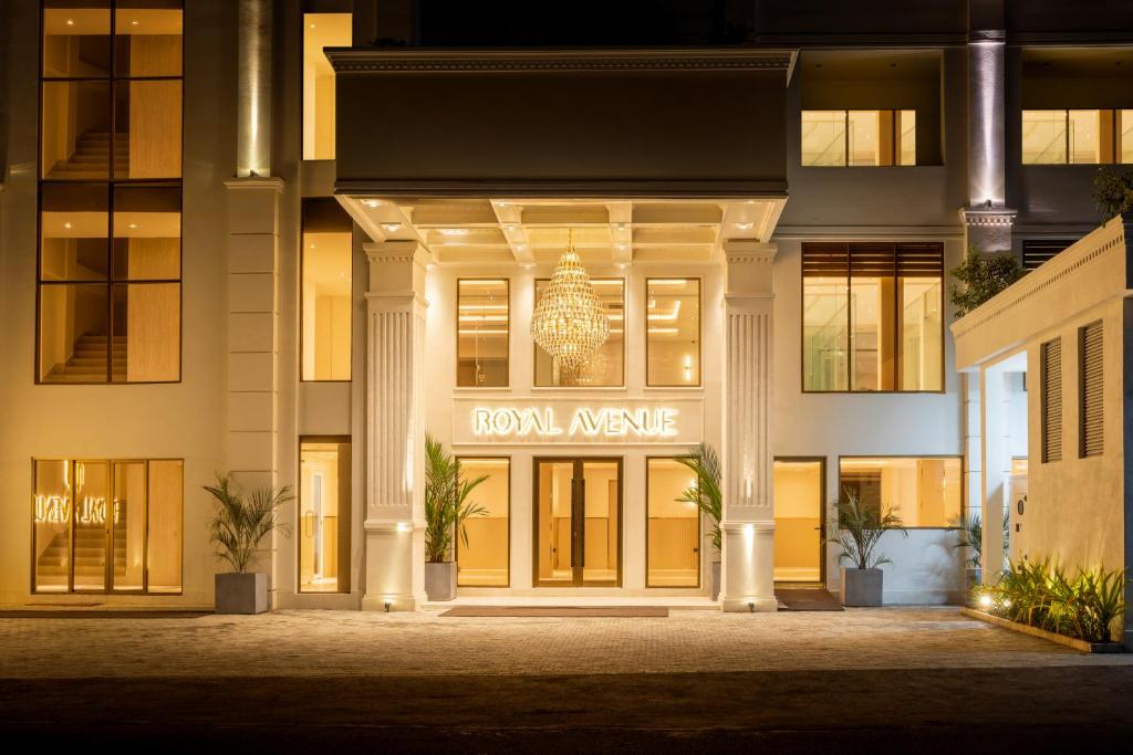 a building with a sign that reads roomamine at Royal Avenue Kandy in Kandy