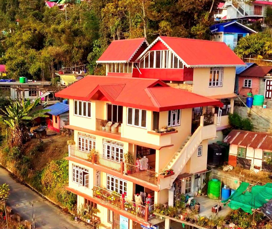 a model of a house with a red roof at Bethany Homestay in Kalimpong