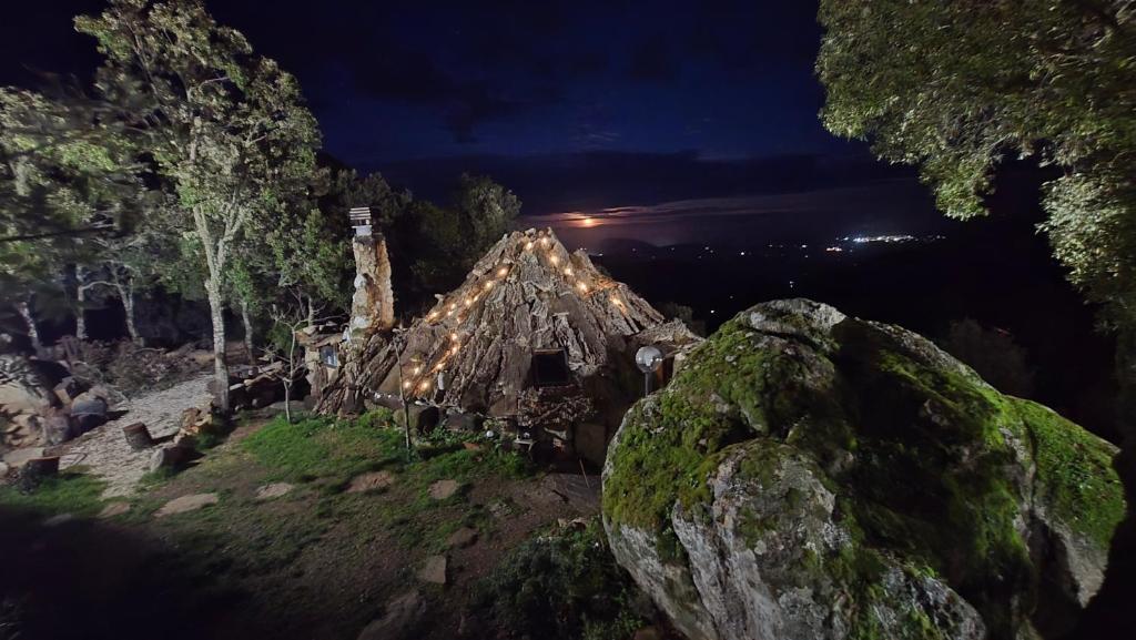 an old house on a hill at night at Rifugio Ortobene in Nuoro