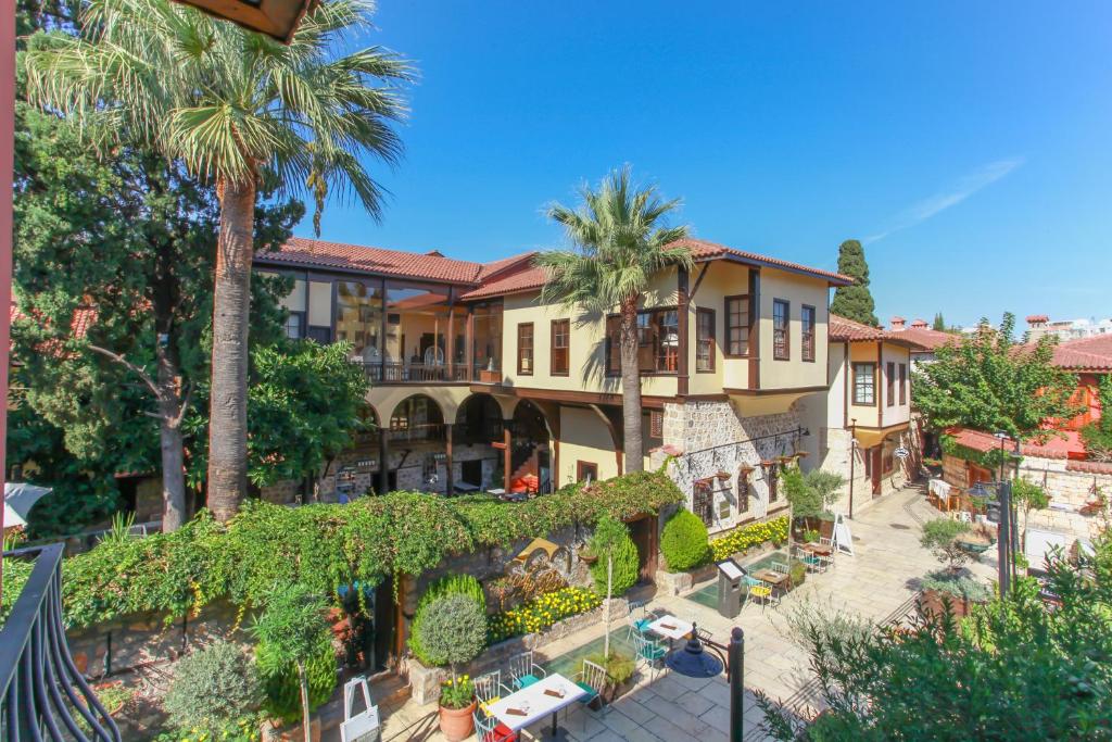 an aerial view of a house with palm trees at Alp Pasa Hotel - Special Class in Antalya