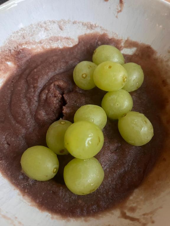 a bunch of green grapes in a bowl at Žilina in Čadca