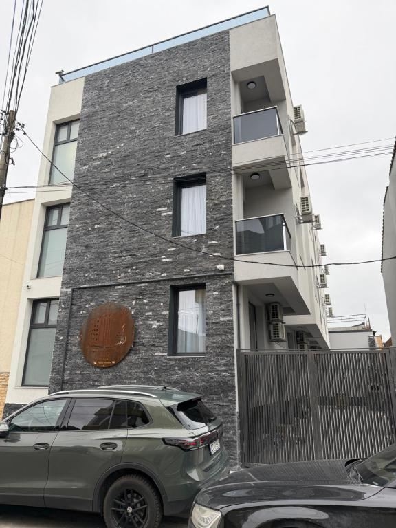 a car parked in front of a building at MavCity Boutique in Constanţa