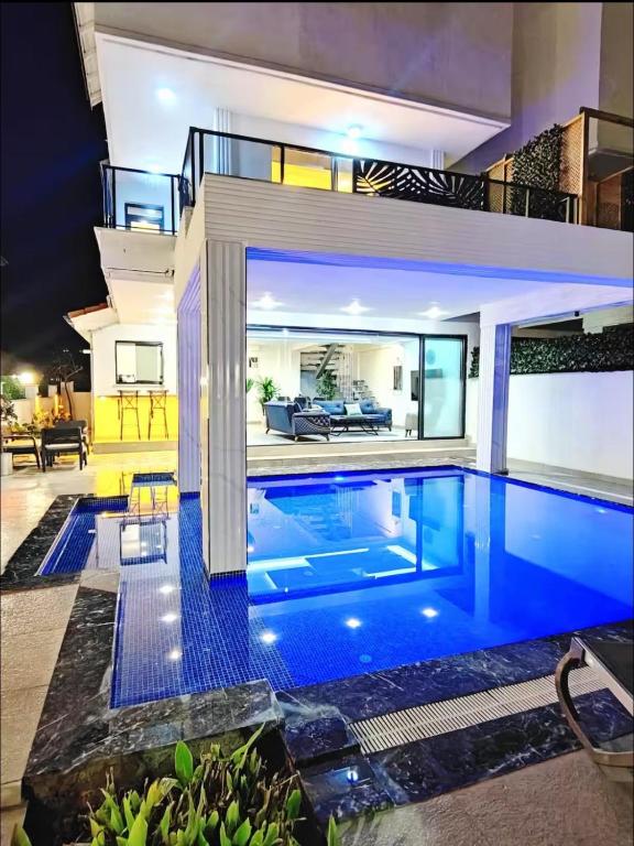 a swimming pool in the middle of a house at My Palace Villa Heated Pool in Belek