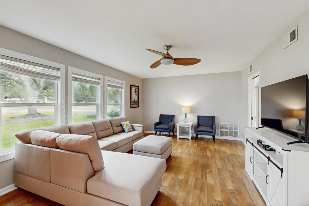 a living room with a couch and a table at The Lazy Oak Retreat in Rockport