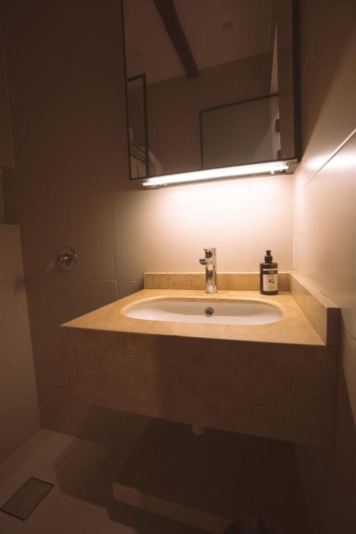 a bathroom with a sink and a mirror at Pharaohs Land Hotel in Cairo
