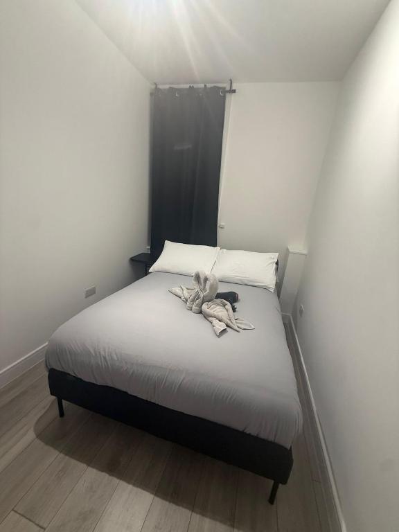 a bed with a stuffed animal on top of it at Balham in London