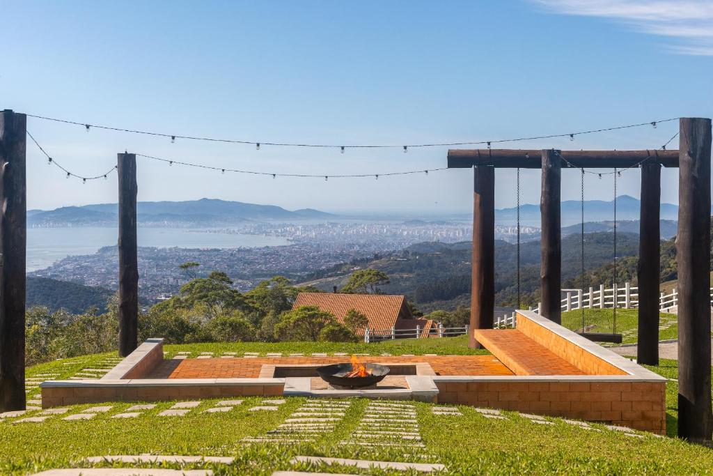 a garden on a hill with a view at Pousada Parador 33 in Biguaçu