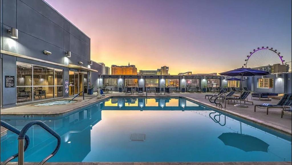 a hotel pool with a view of the city at The Platinum Hotel Las Vegas in Las Vegas