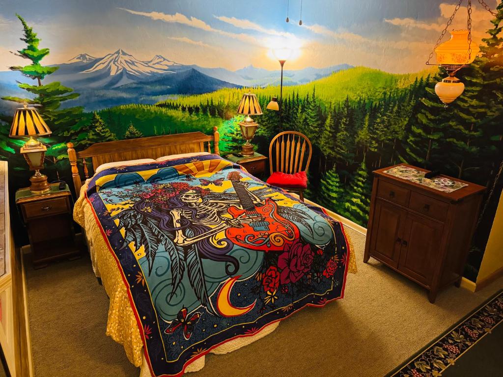 a bedroom with a painting on the wall at Itty Bitty Inn in North Bend