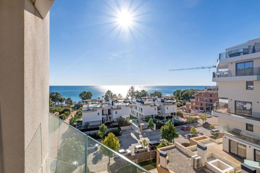 an apartment balcony with a view of the ocean at Waterfront Seaview Residence in Villajoyosa
