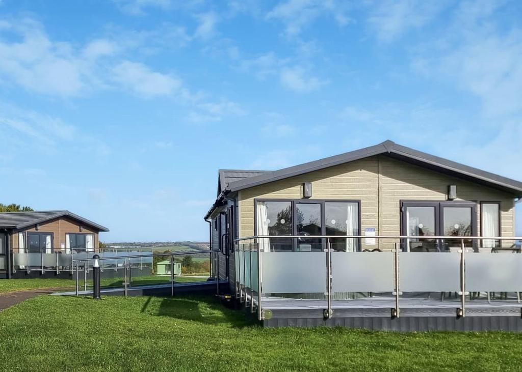 a holiday home with a view of the ocean at Woodlands Park Lodges At Haystax in Knitsley