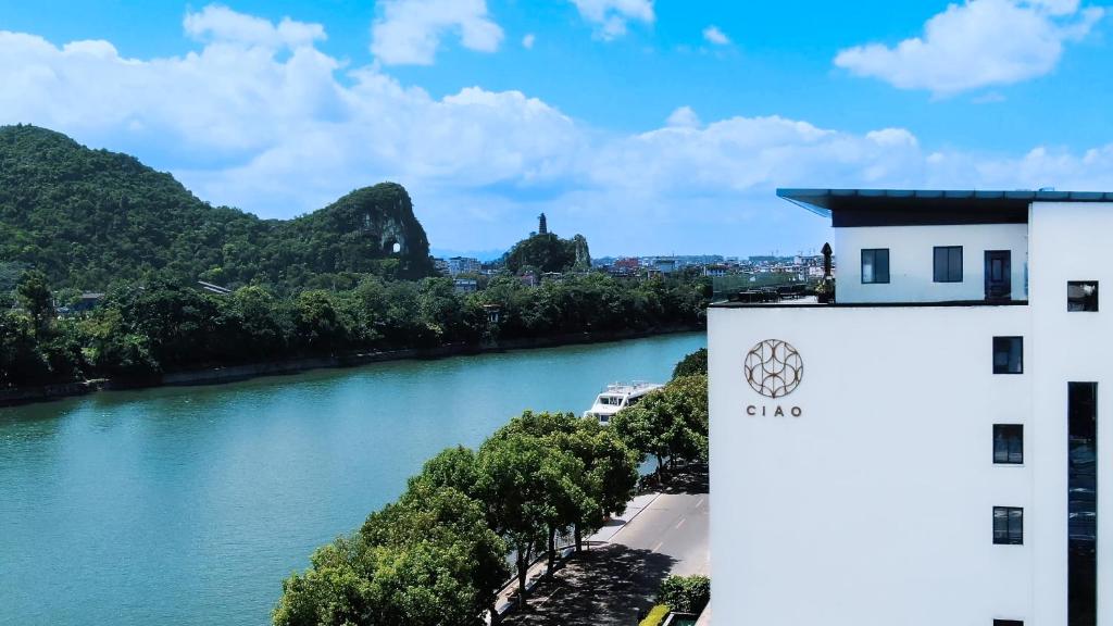 a view of a river from a building at GUILIN LI RIVER CIAO Hotel in Guilin