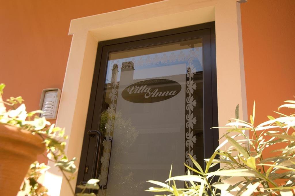 a glass door with a sign on it at Appartamenti Villa Anna in Melegnano