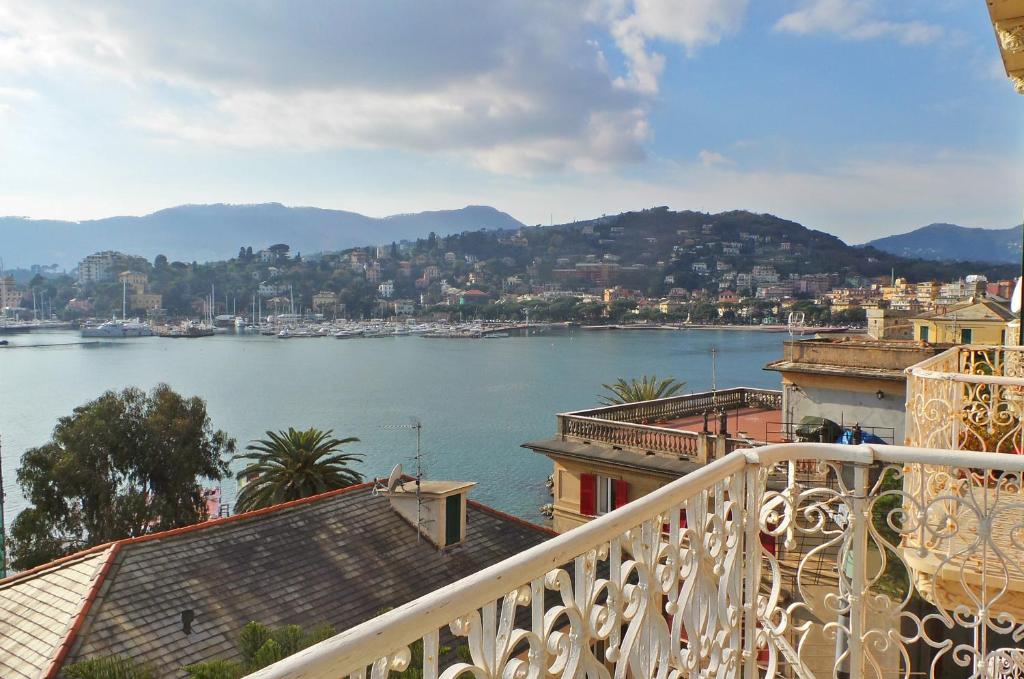 a view of a body of water from a balcony at Carlotta Flexyrent Apartment in Rapallo