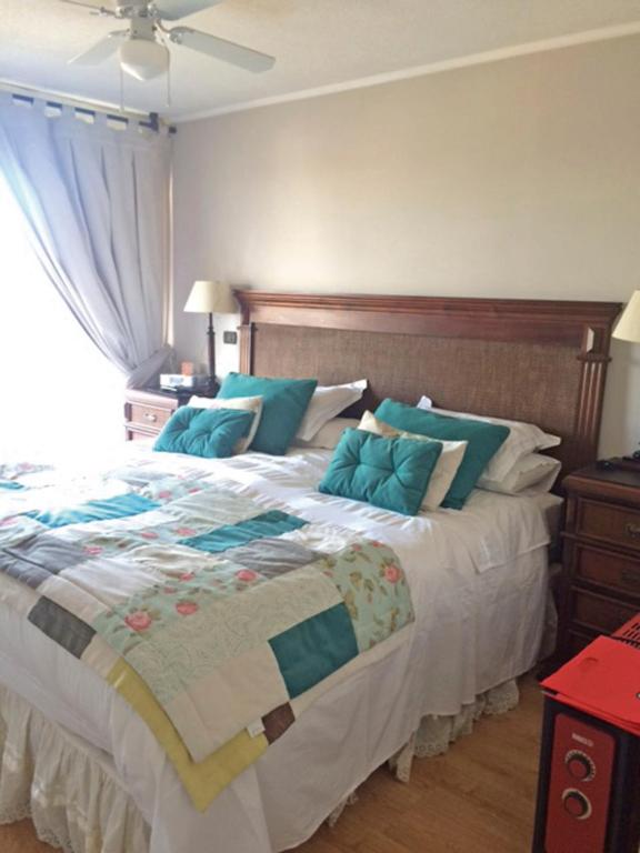Postel nebo postele na pokoji v ubytování Apartamentos Terrazas de Talca