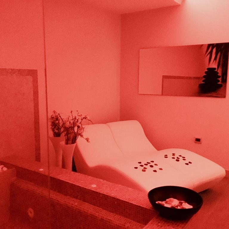 Posteľ alebo postele v izbe v ubytovaní Hotel Roscianum Welness SPA