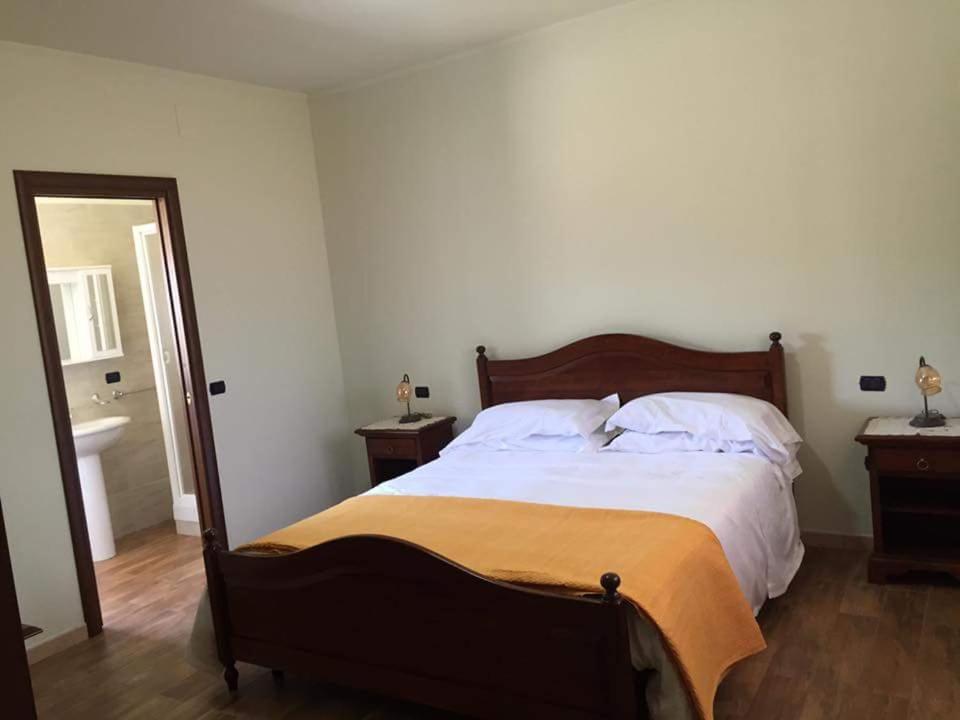 Un pat sau paturi într-o cameră la Agriturismo Montebeltrano
