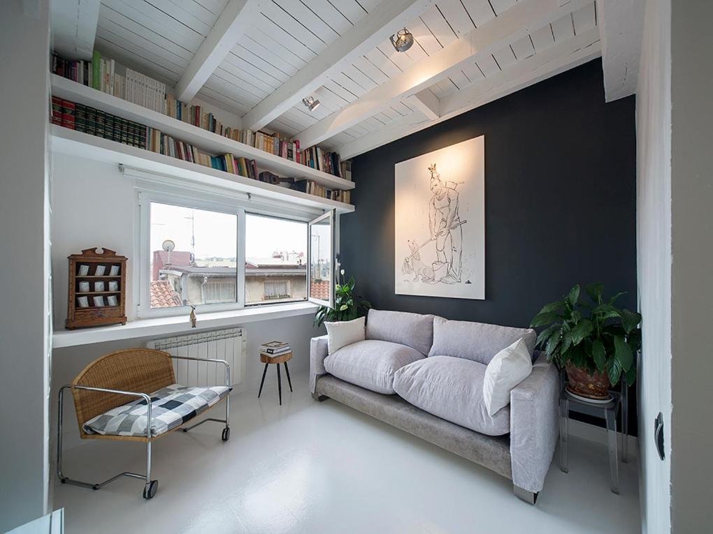 a living room with a couch and a window at Merlot Apartment in San Sebastián