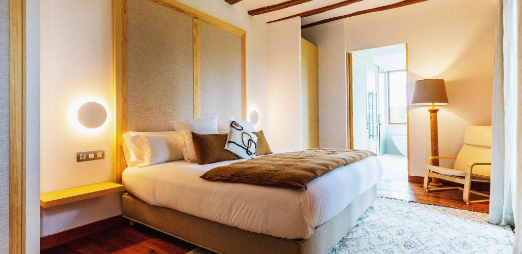 a bedroom with a large bed in a room at Hotel Dakshinkali Resport in Pharping