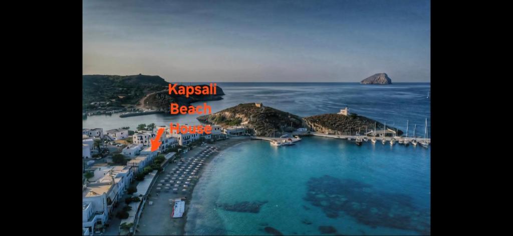 an aerial view of the beach and the ocean at Kapsali Beach House in Kapsali
