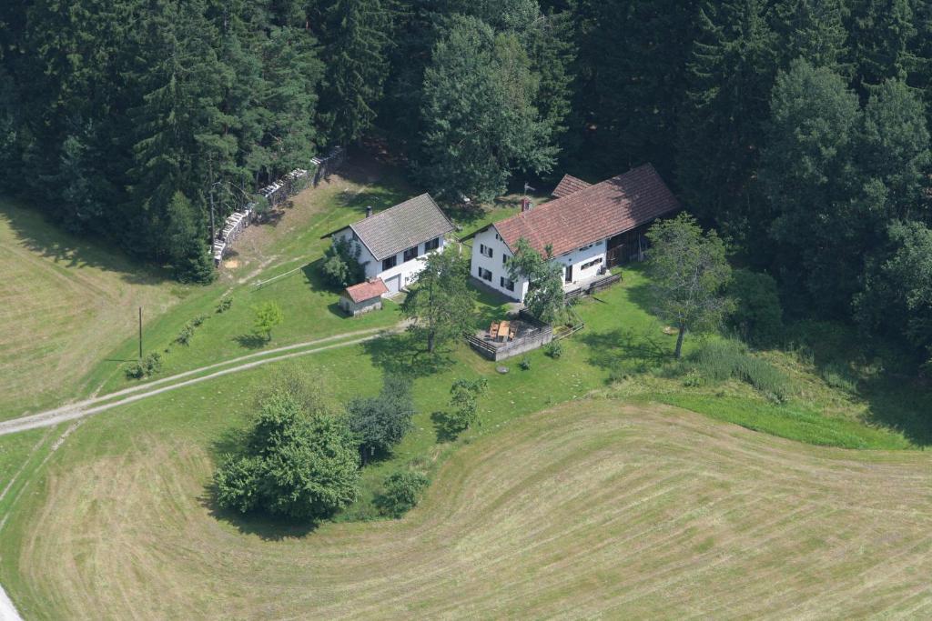 an aerial view of a house in a field at Pension am Waldesrand in Regen