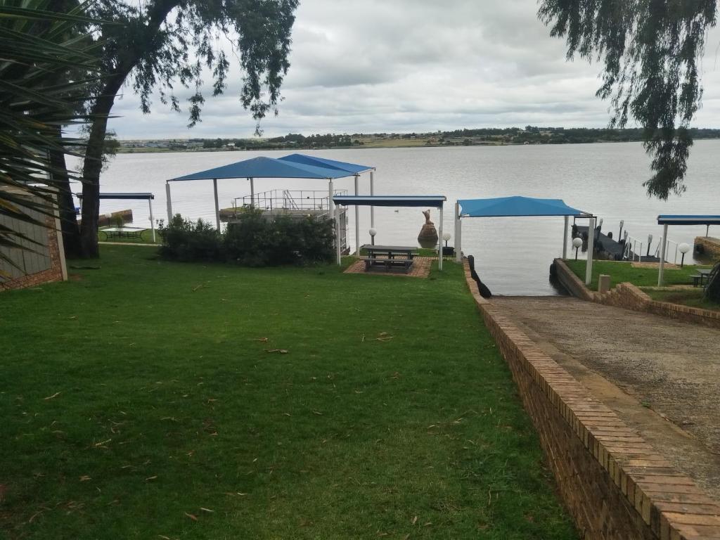 a picnic area with a view of a lake at Elephant hide away in eMalahleni