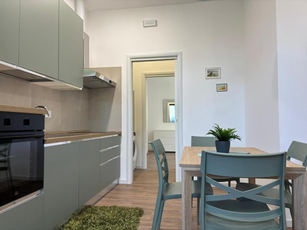 a kitchen with a table and chairs in a room at SARA - interno 2 - Premium Villas in Giulianova