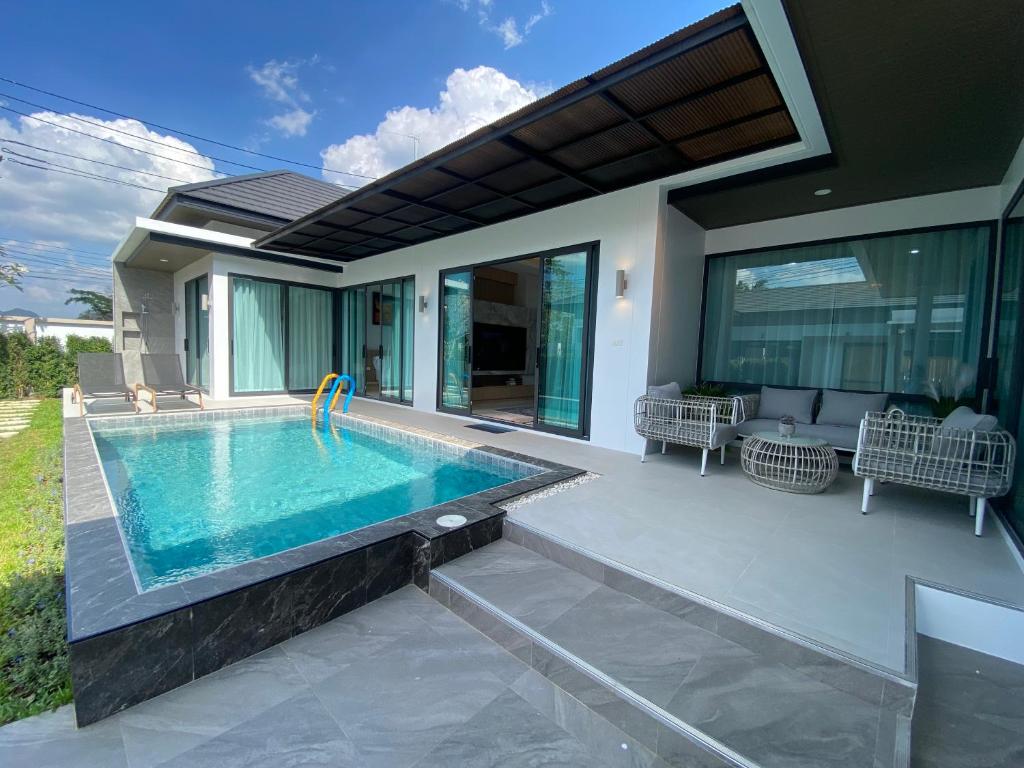 a swimming pool in the backyard of a house at The Casa Del Forest Ao-Nang in Ban Nong Thale