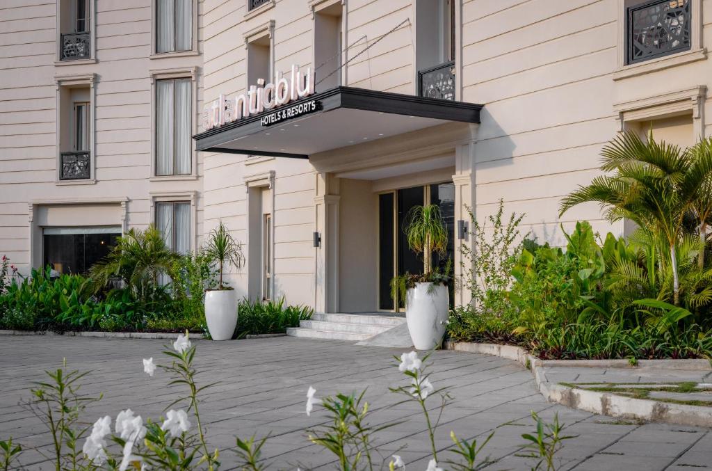 a hotel building with a sign that reads hotelaho at Atlanticblu hotels & Resort in Abuja