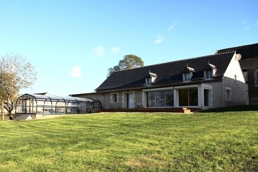 a large house with a large lawn in front of it at La prée in Seligny
