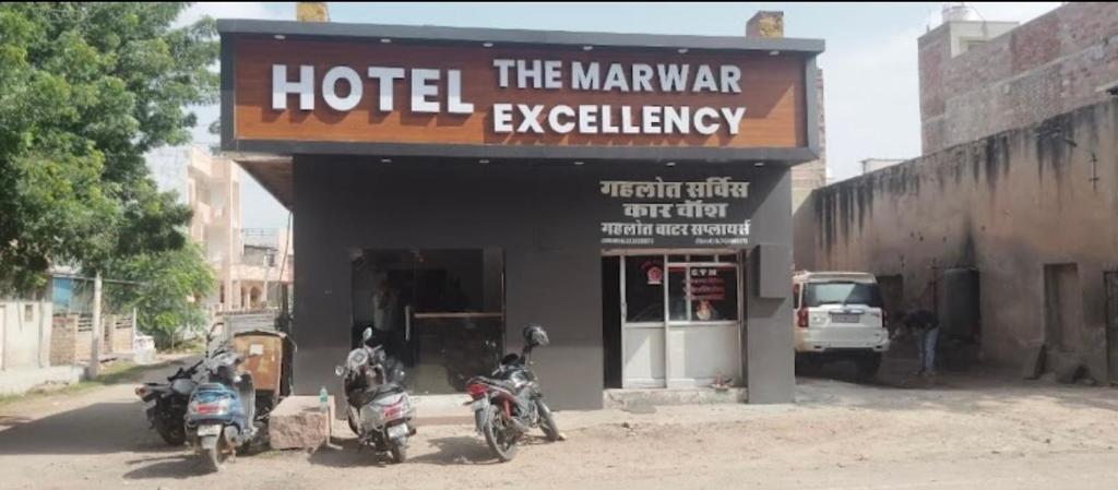 a group of motorcycles parked in front of a hotel at Hotelthemarwarexcellency in Jodhpur