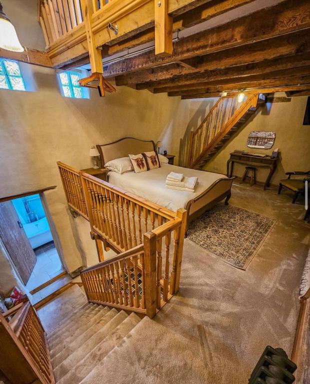 a bedroom with a large bed in a room at The Cow House - In the heart of Whitby in Whitby