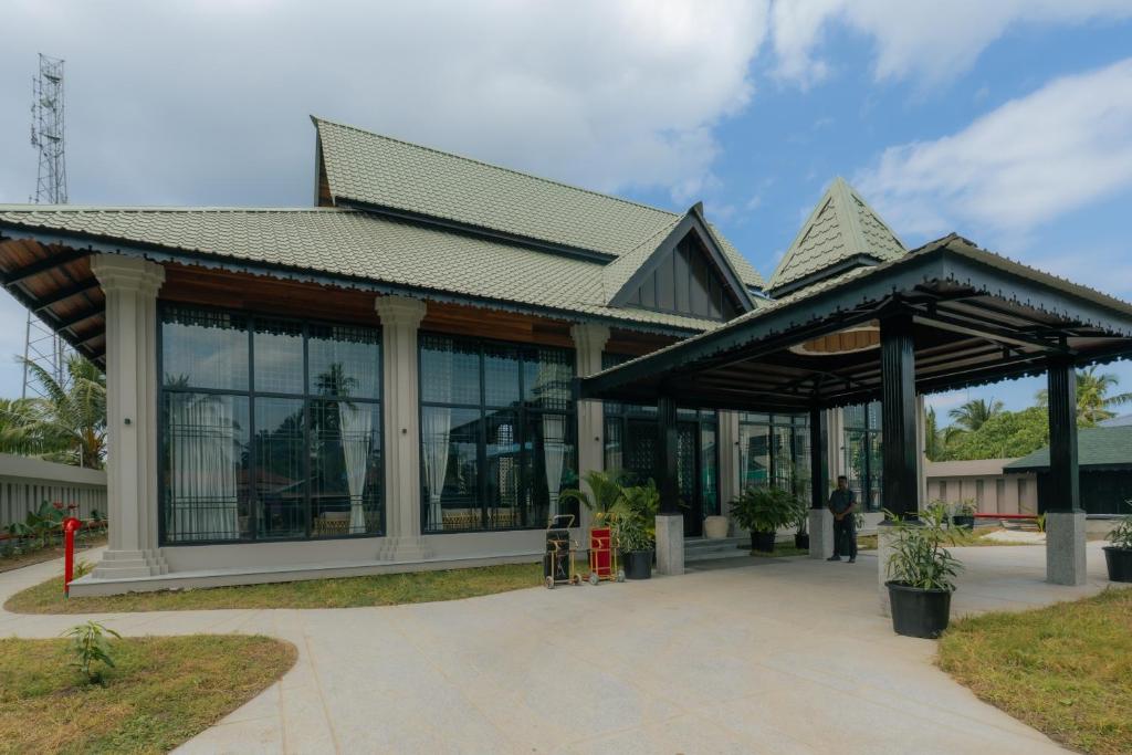 a large building with a roof and windows at Seashell Samssara Havelock in Havelock Island