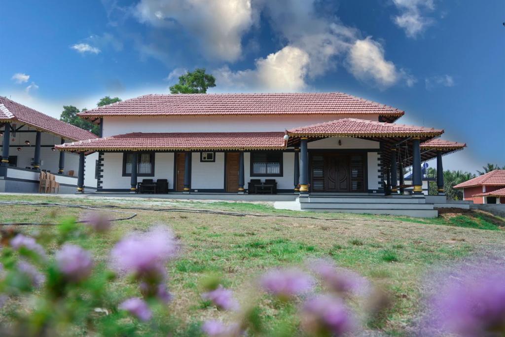 a small house with aium in a yard at Aqua Terra Villas in Belūr