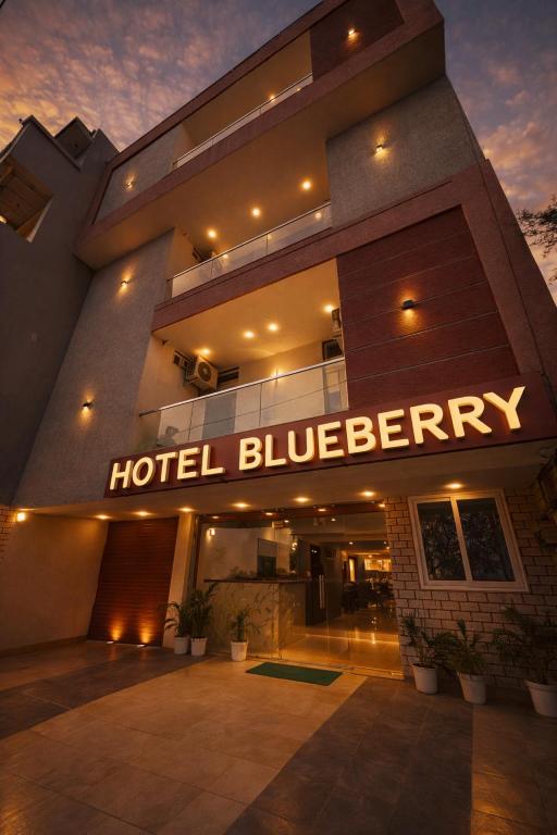 a hotel building with a sign that reads hotel blueberry at Hotel Blueberry Bhedaghat in Jabalpur
