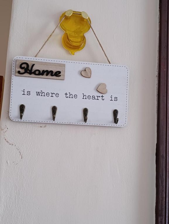 a home is where the heart is sign on a door at FloJoy Haven Machakos in Machakos