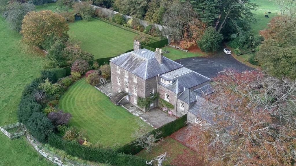 an aerial view of an old house in a field at Glamis House in Forfar