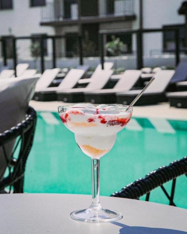 a drink sitting on a table next to a pool at Zlatibor 2 in Zlatibor
