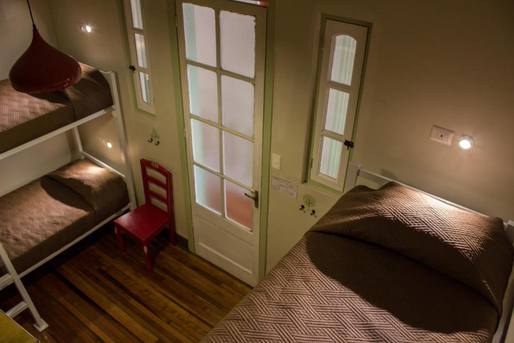 Postel nebo postele na pokoji v ubytování Hostal Providencia