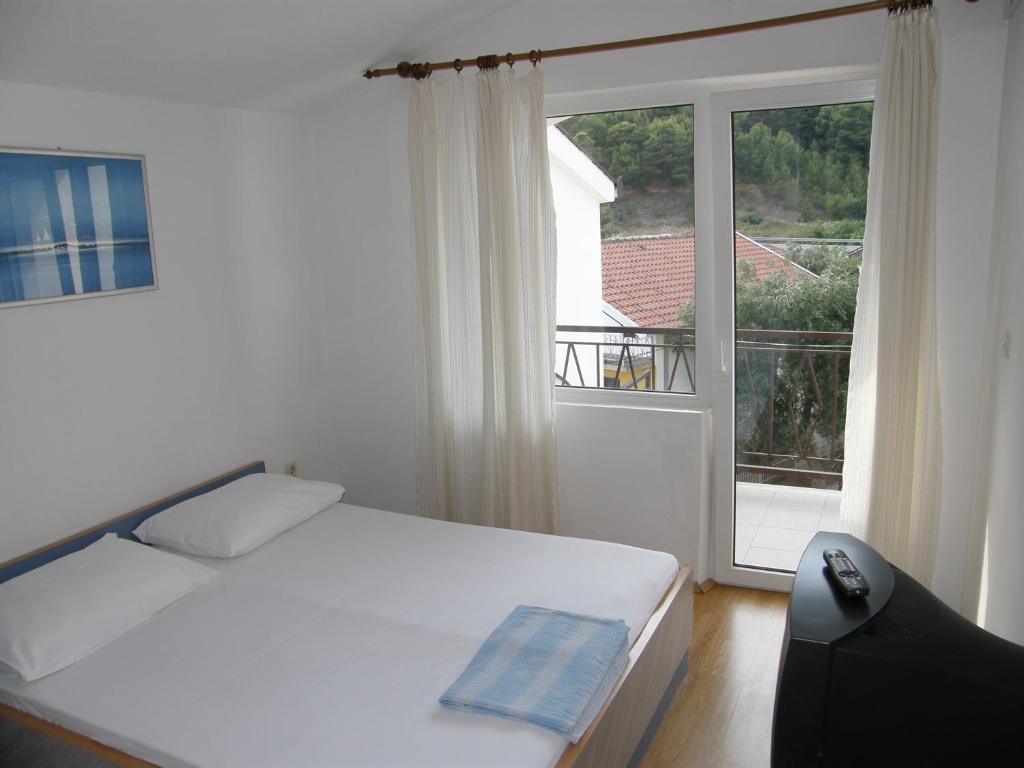 Posteľ alebo postele v izbe v ubytovaní Guest House & Restaurant Adriatic Klek