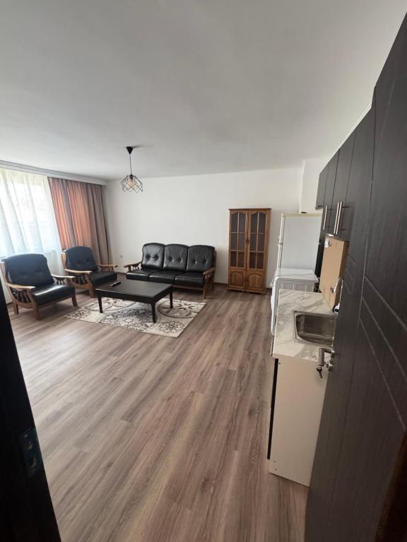 a living room with a couch and a table at Luxury House LUXIMMO in Lyetnitsa