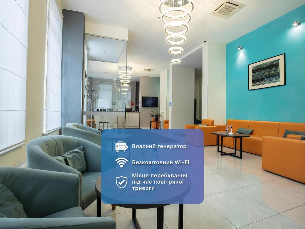 a waiting room with chairs and a sign in the middle at Raziotel Kyiv Yamska in Kyiv